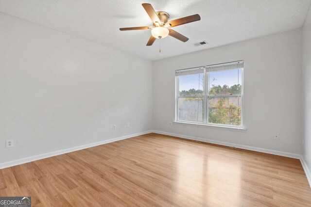 2357 Bayrose Cir Unit 57B, Atlanta, GA 30344 - unfurnished room featuring light wood-type flooring, a textured ceiling, and ceiling fan
