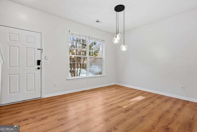 2357 Bayrose Cir Unit 57B, Atlanta, GA 30344 - unfurnished dining area featuring light wood-type flooring