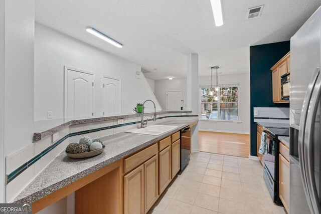 2357 Bayrose Cir Unit 57B, Atlanta, GA 30344 - kitchen with black appliances, a textured ceiling, light tile patterned floors, pendant lighting, and sink