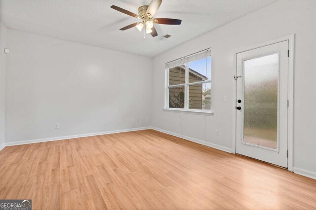 2357 Bayrose Cir Unit 57B, Atlanta, GA 30344 - empty room with a textured ceiling, light hardwood / wood-style floors, and ceiling fan