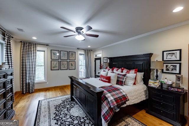 bedroom with ceiling fan, light hardwood / wood-style flooring, and ornamental molding