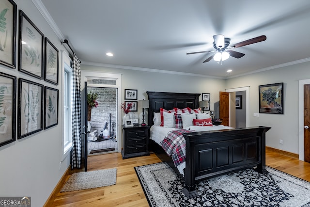 bedroom featuring ornamental molding, light wood-type flooring, and ceiling fan