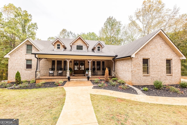 view of front facade with a front lawn and a porch