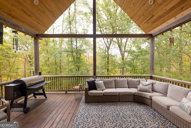 wooden terrace featuring area for grilling and an outdoor hangout area