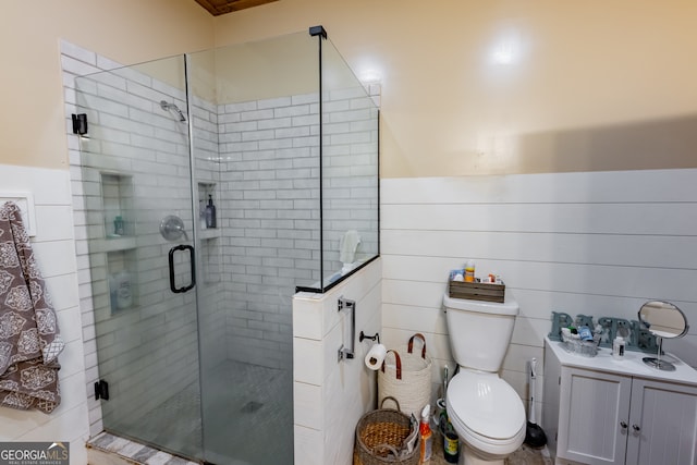 bathroom with toilet, an enclosed shower, and tile walls