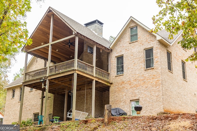 back of property with ceiling fan