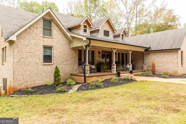 view of front facade with a porch and a front yard