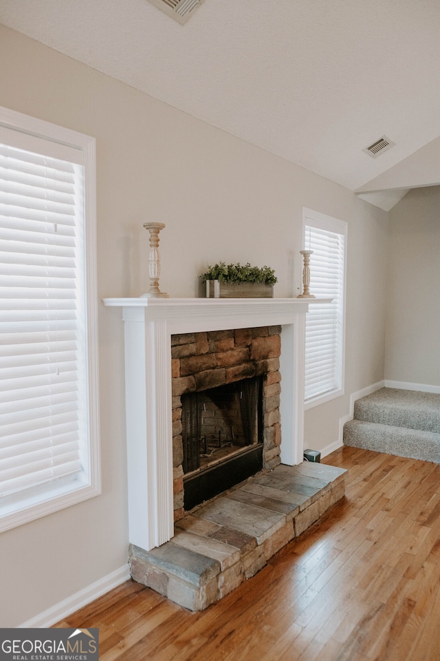 room details featuring hardwood / wood-style floors and a fireplace