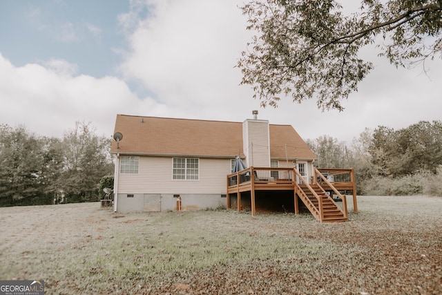 rear view of house featuring a deck