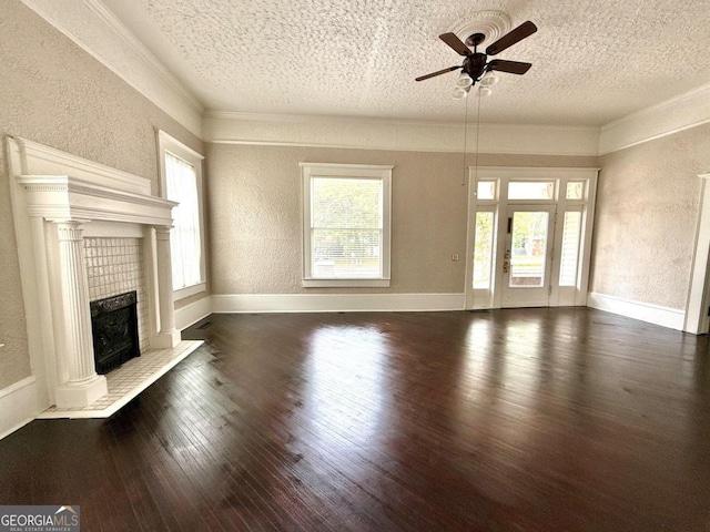 unfurnished living room featuring a fireplace, dark wood-type flooring, a textured ceiling, and ceiling fan