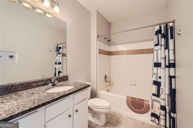 full bathroom featuring tile patterned flooring, vanity, shower / bath combo with shower curtain, and toilet