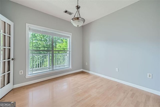 spare room featuring light hardwood / wood-style flooring