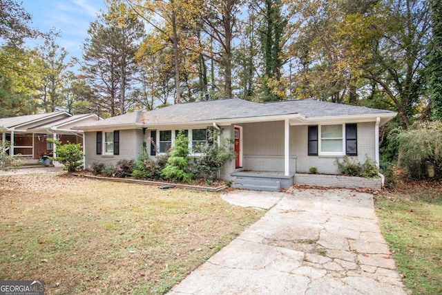 single story home with covered porch and a front lawn