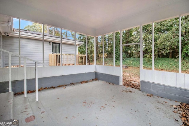 unfurnished sunroom featuring plenty of natural light