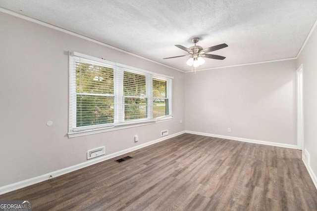 spare room featuring a textured ceiling, dark hardwood / wood-style flooring, ceiling fan, and crown molding