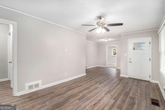 entrance foyer with ceiling fan, a textured ceiling, dark hardwood / wood-style floors, and crown molding