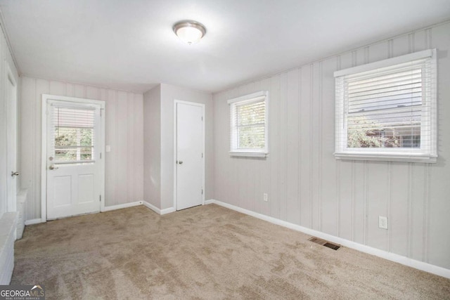 empty room featuring light colored carpet