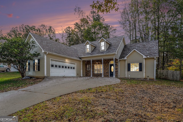 cape cod home with a garage