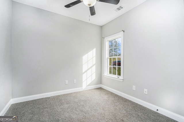 carpeted empty room featuring ceiling fan