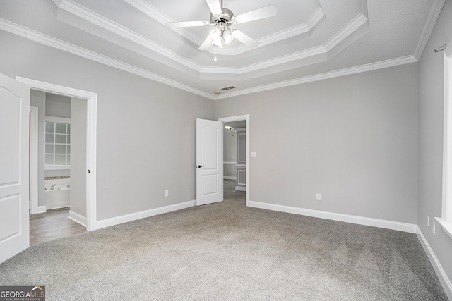 unfurnished bedroom with ceiling fan, crown molding, and carpet flooring