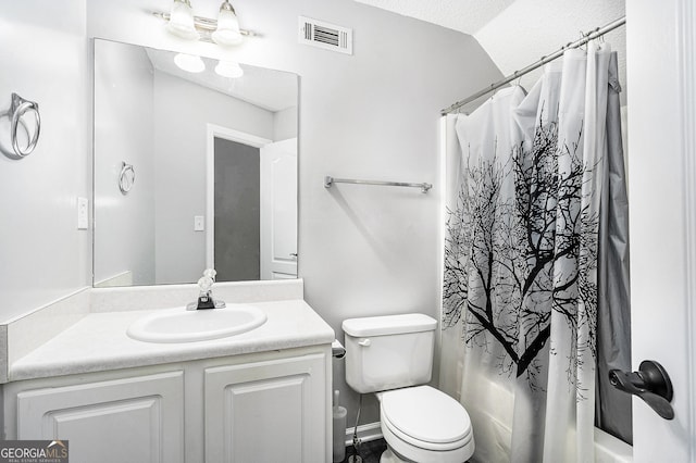 full bathroom featuring shower / bath combination with curtain, vaulted ceiling, a textured ceiling, toilet, and vanity