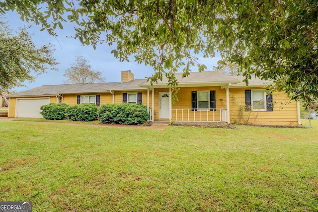 ranch-style house with a porch, a front yard, and a garage