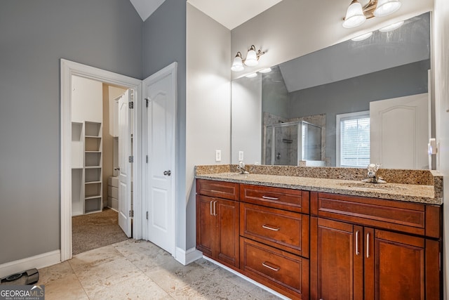 bathroom with vanity and walk in shower