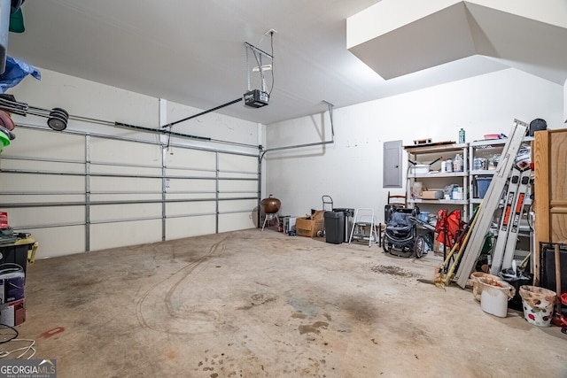 garage featuring a garage door opener and electric panel