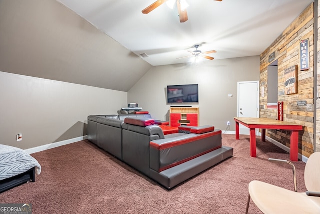 living room featuring carpet floors, vaulted ceiling, and ceiling fan