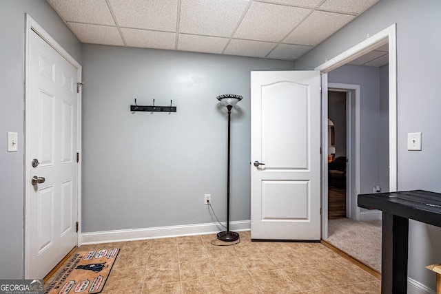 interior space featuring a drop ceiling