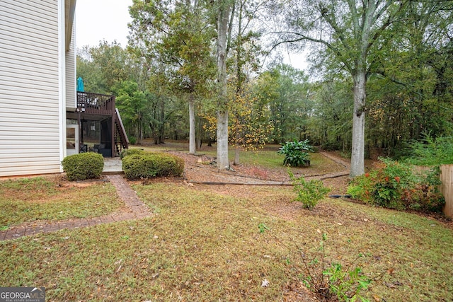 view of yard featuring a wooden deck