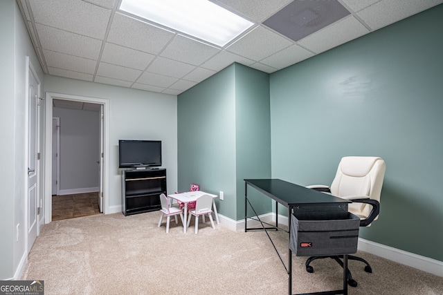 interior space with a paneled ceiling