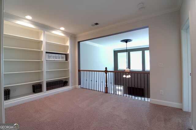 carpeted empty room featuring ornamental molding