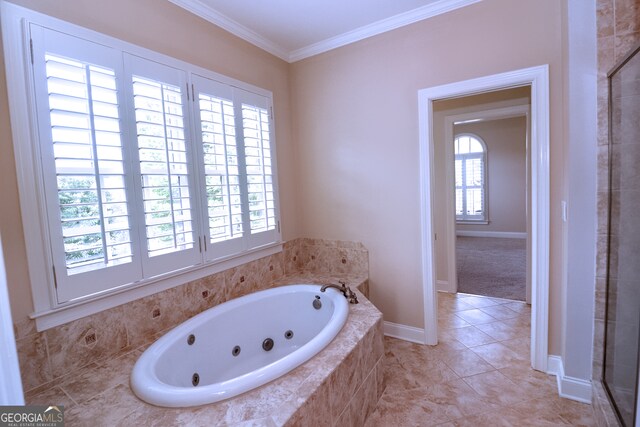 bathroom with tile patterned flooring, a healthy amount of sunlight, shower with separate bathtub, and ornamental molding