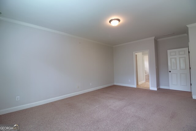 carpeted spare room with ornamental molding