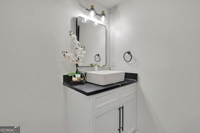 bathroom with water heater and vanity