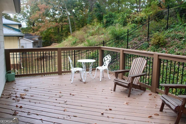 wooden deck featuring fence