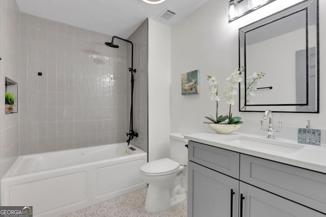 full bathroom with toilet, bathing tub / shower combination, visible vents, and vanity