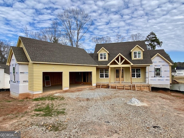 property in mid-construction featuring a garage and covered porch