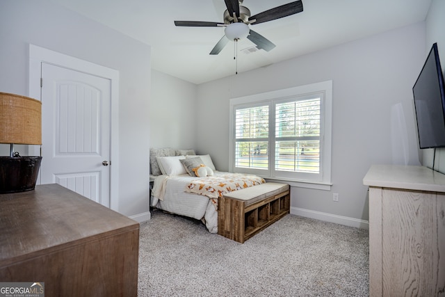 carpeted bedroom with ceiling fan