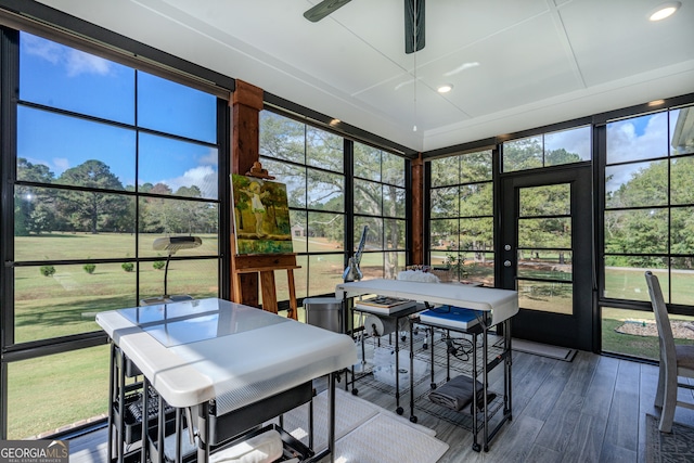 sunroom / solarium with ceiling fan and a healthy amount of sunlight