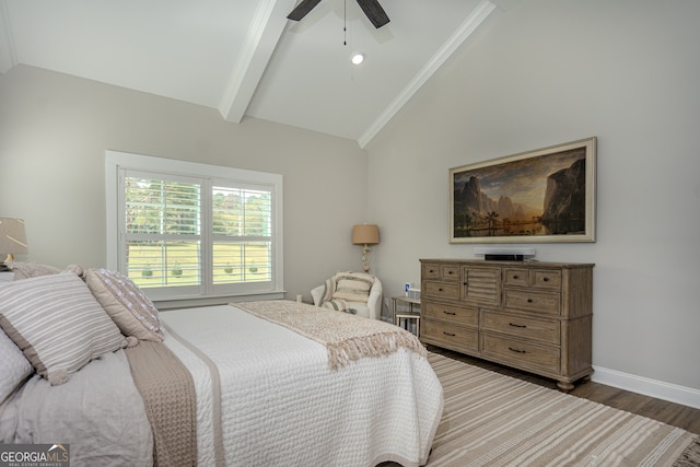 bedroom featuring ceiling fan, dark hardwood / wood-style flooring, lofted ceiling with beams, and ornamental molding