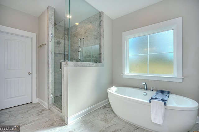 bathroom with shower with separate bathtub