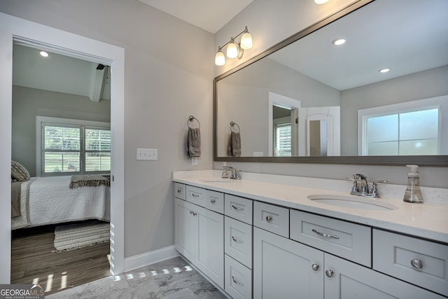 bathroom featuring hardwood / wood-style floors and vanity