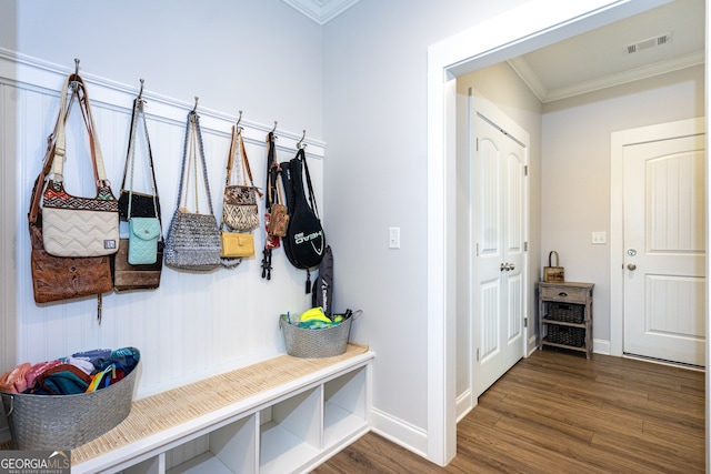 mudroom with dark hardwood / wood-style floors and ornamental molding