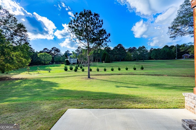 view of home's community with a lawn