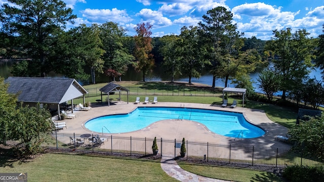 view of pool featuring a gazebo, a water view, a yard, and a patio area