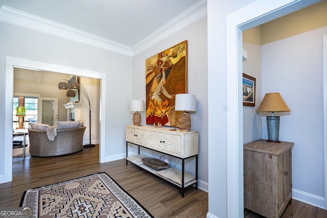 hallway with dark hardwood / wood-style flooring and ornamental molding