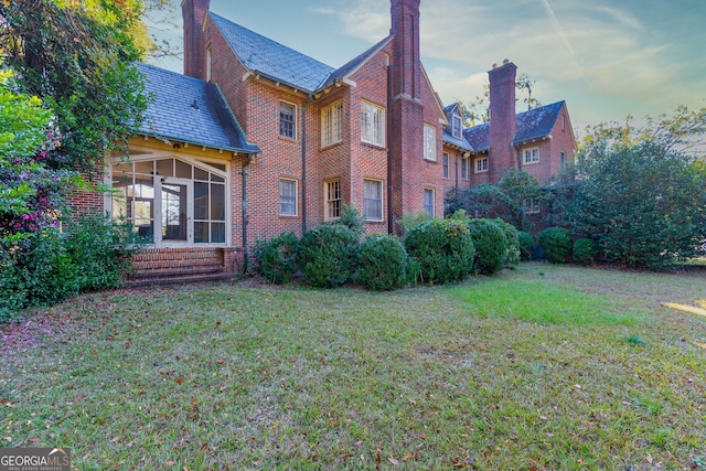 view of yard with a sunroom