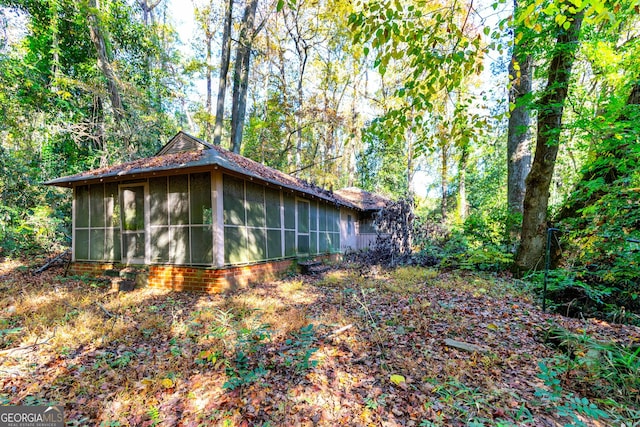 view of home's exterior featuring a sunroom